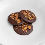 Hand poured 70% Cacao Dark Chocolate with Hazelnuts